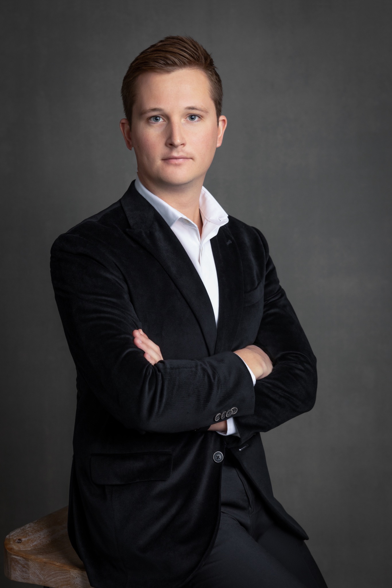 Professional headshot on a dark background by Ti Adoro Studios